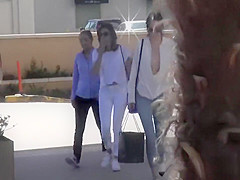 Smoking hot celebrity walks around in a flimsy shirt and tight pants